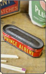 Antique Match Safe, a miniature Prince Albert Tobacco can . This is a very old match safe. The top is hinged and is tight. The bottom has the PRINCE A - 1 of 7