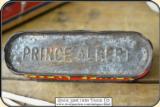 Antique Match Safe, a miniature Prince Albert Tobacco can . This is a very old match safe. The top is hinged and is tight. The bottom has the PRINCE A - 5 of 7