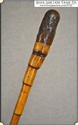 An
incredibly beautiful, unique late nineteenth century antique Bamboo walking stick. This cane has a lot of character and substance. The shaft is ma - 1 of 8
