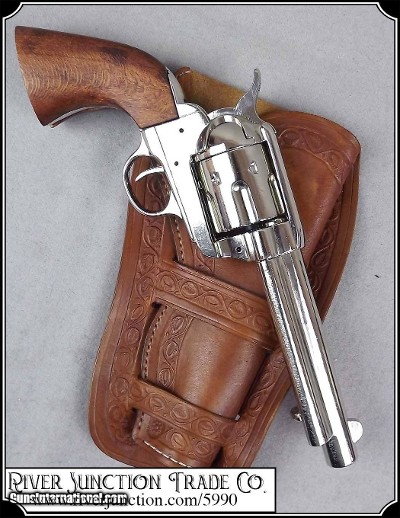 Non- firing Bright Nickel plated 1873 Colt. with genuine wood grips