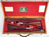 CASED PAIR OF SPECTACULAR W.C. SCOTT AND SON DOUBLE BARREL SIDE LOCK SHOTGUNS IN 12 GAUGE - 1 of 11