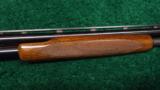  WINCHESTER MODEL 42 410 PUMP ACTION SHOTGUN WITH A SIMMONS RIB - 7 of 13