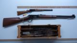 SIX MINIATURE WINCHESTER 1894 LEVER ACTION RIFLES IN WOODEN CRATE - 12 of 13