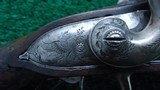 FANTASTIC SILVER MOUNTED ENGRAVED GOLD ACCENTED AND RELIEF CARVED DOUBLE BARREL FLINTLOCK SHOTGUN BY PIRMET of PARIS - 7 of 24