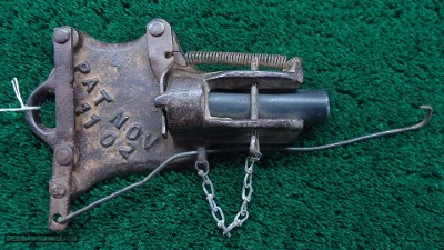 VERY INTERESTING CAST IRON TRAP GUN