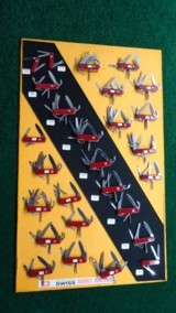 VERY INTERESTING AND UNIQUE FACTORY DISPLAY BOARD WITH 27 SWISS ARMY KNIVES