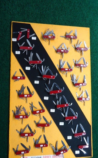 VERY INTERESTING AND UNIQUE FACTORY DISPLAY BOARD WITH 27 SWISS ARMY KNIVES