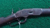 WINCHESTER MODEL 1873 RIFLE WITH INSCRIBED STOCK IN CALIBER 44 WCF