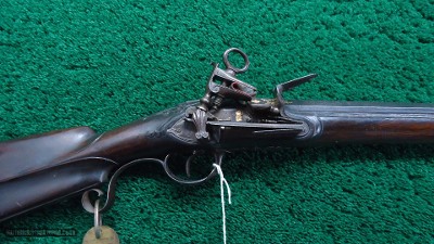 SPANISH MIQUELET GOLD INLAID AND CARVED SPORTING FLINTLOCK OF ABOUT 16 BORE