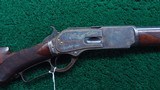 OUTSTANDING FACTORY ENGRAVED WINCHESTER MODEL 1876 DELUXE RIFLE IN 50 EXPRESS