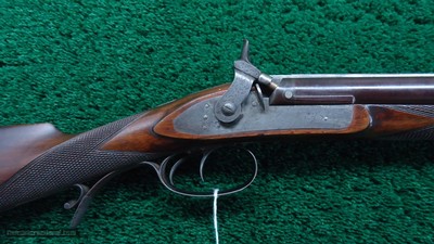 ENGLISH PERCUSSION DOUBLE RIFLE IN ABOUT 60 CALIBER BY E.E. HENNIKER