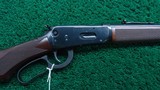 WINCHESTER MODEL 94AE LEGACY ROUND BARREL CHECKERED PISTOL GRIP DELUXE CARBINE CHAMBERED IN 30 WIN