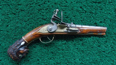 ENGRAVED EUROPEAN FLINTLOCK POCKET PISTOL WITH FIGURAL “MOOR’S HEAD” CARVED POMMEL