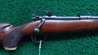 CUSTOM ENGRAVED WINCHESTER MODEL 70 RIFLE IN CALIBER .257 ROBERTS - Image 1 of 25
