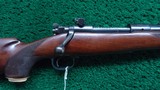 CUSTOM ENGRAVED WINCHESTER MODEL 70 RIFLE IN CALIBER .257 ROBERTS - Image 1 of 25