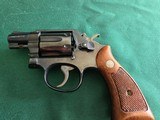 Smith & Wesson Model 10 5, 2 inch, square butt, original box.