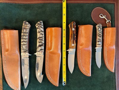 J.B.MOORE SET OF 4 CUSTOM KNIVES, BIG HORN SHEEP AND AMBER STAG, WITH SHEATHS, NEW