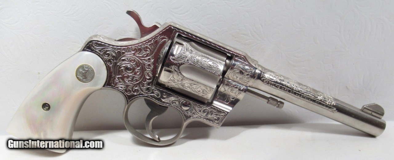 Two old metal colt revolver Stock Photo by ©witoldkr1 7355286