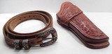 FANTASTIC HOLSTER and TOOLED BELT from COLLECTING TEXAS – A.W. BRILL of AUSTIN, TEXAS MADE HOLSTER with GOLD, SILVER, and RUBY BUCKLED BELT - 1 of 12
