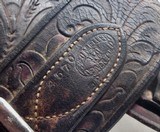 GROUP of 13 TOTAL BELTS and BUSCADEROS from COLLECTING TEXAS – H.H. HEISER, A.E. NELSON, RED MUELLER, COLORADO SADDLERY, GEO. LAWRENCE, ETC. - 24 of 25
