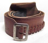 GROUP of 13 TOTAL BELTS and BUSCADEROS from COLLECTING TEXAS – H.H. HEISER, A.E. NELSON, RED MUELLER, COLORADO SADDLERY, GEO. LAWRENCE, ETC. - 11 of 25