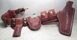 EL PASO SADDLERY MADE GUN RIG with SMITH & WESSON HANDCUFFS from COLLECTING TEXAS