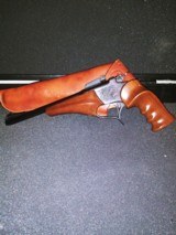 1983 Thompson Center Arms pistol with 6 barrel/caliber options, holster, scope, foregrips, and carry case. - 8 of 9
