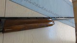 Remington 20 gauge Model 1100 Standard field model with 12 gauge receiver - 12 of 15