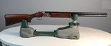 Mossberg Silver Reserve 12 Gauge Inlaid Gold and Silver Scrolling - 1 of 5