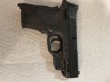 Smith and Wesson M&P EZ 9mm with Crimson Trace - 1 of 5