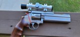 S&W Mod 617, Stainless, 5" barrel,
6 shot .22LR with wood grips, scope and weights - 1 of 10