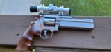 S&W Mod 617, Stainless, 5" barrel,
6 shot .22LR with wood grips, scope and weights - 2 of 10