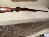 1955 Winchester M70 barreled
to 338 06, excellent condition