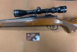 Nice Remington 700 rifle in 6 mm Rem, 22” barrel wood stock and vintage Tasco scope
