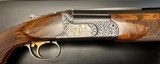 ONE OF THE FINEST KOLAR ONE OF A KIND .750 BORE 32” FLAT RIB SPORTING BULINO GAME & SCROLL BY MASTER ENGRAVER THIERRY DUGUET EXHIBITION WOOD