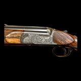 PERAZZI SCO 12GA 32” BARRELS WITH EIGHT TEAGUE CHOKES FULL COVERAGE SCROLL ENGRAVING WITH CHIMERA FIGURES FIGURED WOOD CLAYS/HELICE/PIGEON GUN