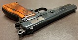 PRISTINE ORIGINAL CONDITION BROWNING HI POWER T SERIES 9MM PISTOL THREE MAGAZINES, ORIGINAL POUCH, & OWNERS MANUAL BUILT IN 1969 - Image 7 of 9