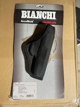 Bianchi 7000 Accumold Holster - Part No 17688
/
Bianchi 7001 AccuMold Holster - Part No 17727 -
Size 9 - Brand New - 3 of 4