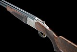 BROWNING 12-GA 'ULTRA XS' SINGLE-TRIGGER OVER AND UNDER EJECTOR IN ALLOY FLIGHT CASE - 1 of 8