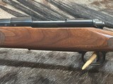 FREE SAFARI, NEW WINCHESTER MODEL 70 FEATHERWEIGHT 300 WSM (WIN SHORT MAG) WITH GOOD WOOD STOCK 22