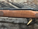 FREE SAFARI, NEW WINCHESTER MODEL 70 FEATHERWEIGHT 300 WIN MAG RIFLE 22