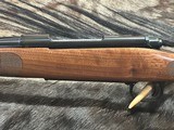 FREE SAFARI, NEW WINCHESTER MODEL 70 FEATHERWEIGHT 300 WIN MAG RIFLE 22