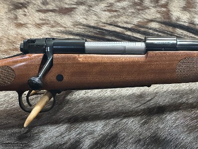 FREE SAFARI, NEW WINCHESTER MODEL 70 FEATHERWEIGHT 300 WIN MAG RIFLE 24
