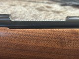 FREE SAFARI, NEW WINCHESTER MODEL 70 FEATHERWEIGHT 300 WIN MAG RIFLE 22