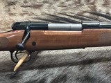 FREE SAFARI, NEW WINCHESTER MODEL 70 FEATHERWEIGHT 300 WIN MAG RIFLE 22