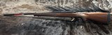 FREE SAFARI, NEW WINCHESTER MODEL 70 FEATHERWEIGHT 300 WIN MAG RIFLE 22