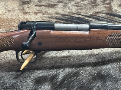 FREE SAFARI, NEW WINCHESTER MODEL 70 FEATHERWEIGHT 300 WIN MAG RIFLE 24