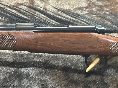 FREE SAFARI, NEW WINCHESTER MODEL 70 FEATHERWEIGHT 300 WIN MAG RIFLE 24