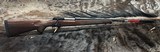 FREE SAFARI, NEW WINCHESTER MODEL 70 FEATHERWEIGHT 300 WIN MAG RIFLE 22