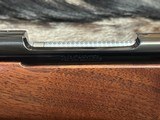 FREE SAFARI, NEW WINCHESTER MODEL 70 FEATHERWEIGHT 300 WIN MAG RIFLE 22